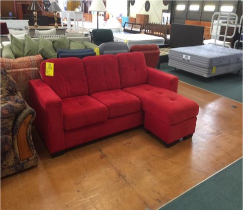 Red three-seater lounge suite with chaise in the Ginza Bargains showroom